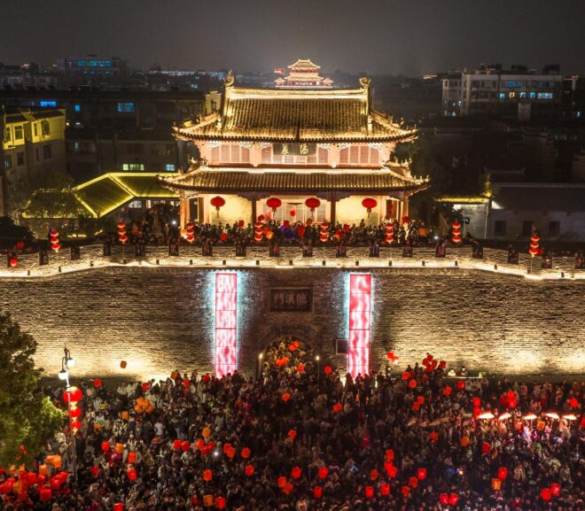 Xiangyang, China: locals welcome the Chinese New Year by flying sky lanterns and experiencing intangible cultural heritage.